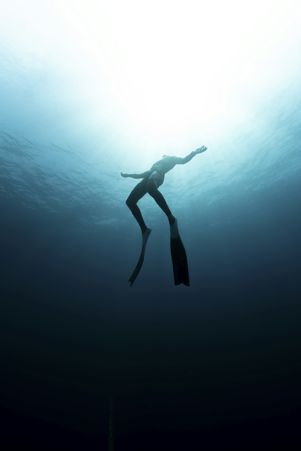 a woman is diving in the water