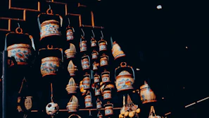 A collection of handwoven baskets arranged artfully against a warm, textured backdrop.