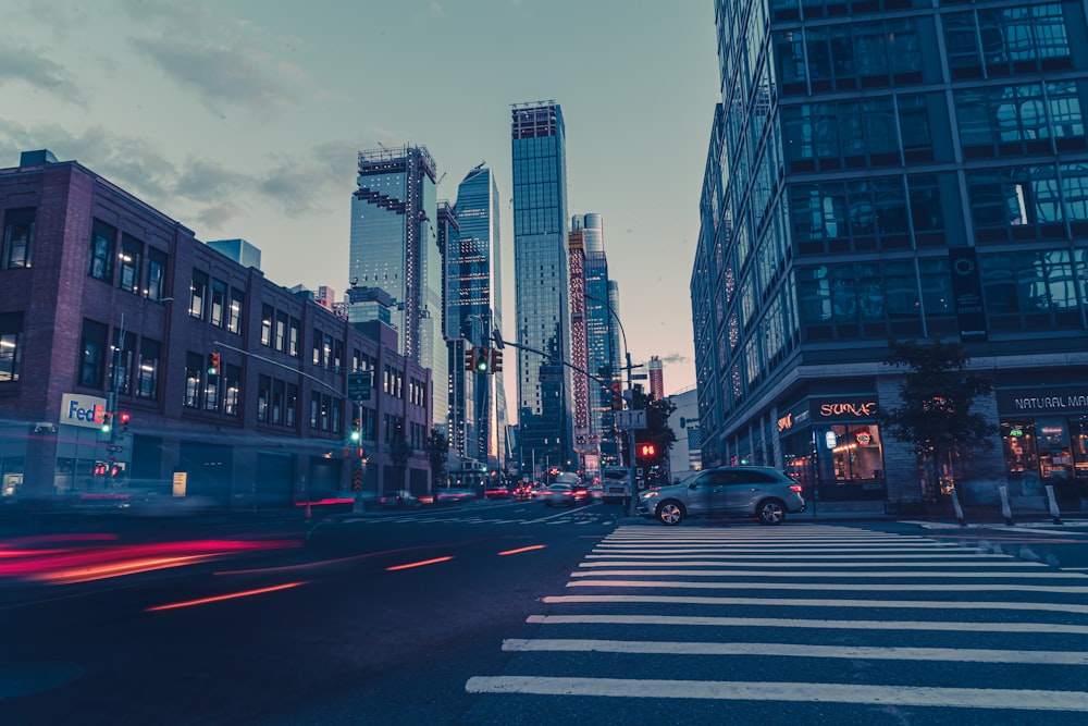 a city street filled with lots of tall buildings