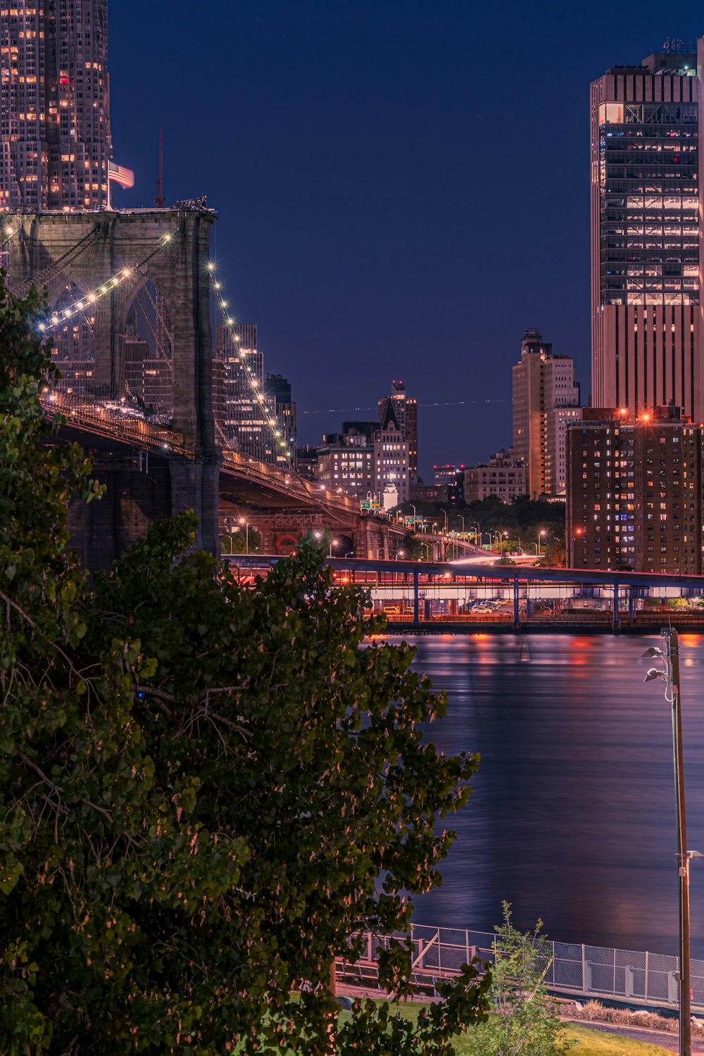 a view of a city at night from across the river