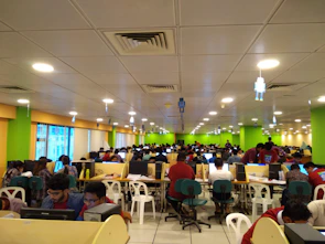 Image of a busy telemarketing room with agents focused on their computer screens