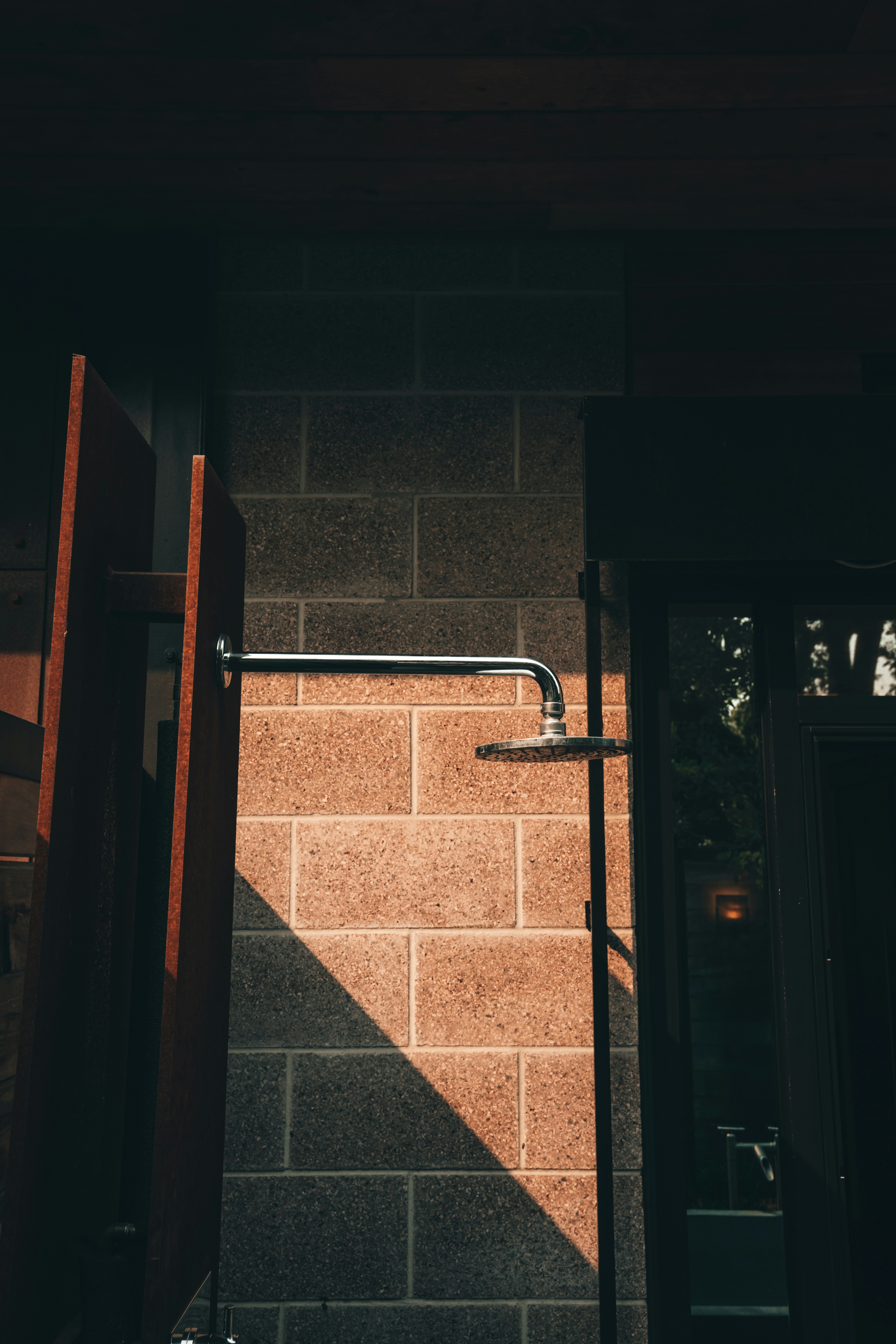 a brick wall with a metal door handle