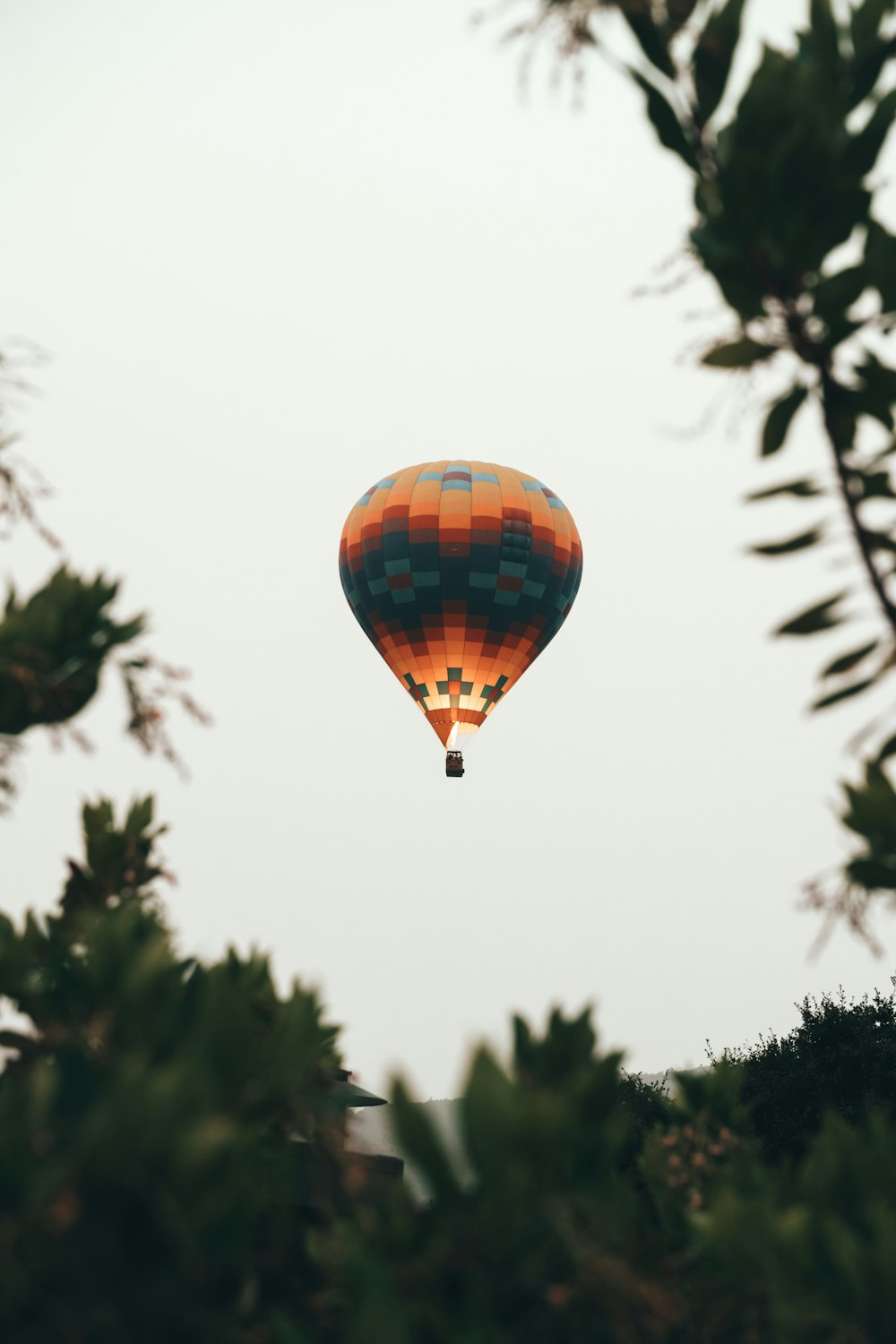 a hot air balloon flying through the air