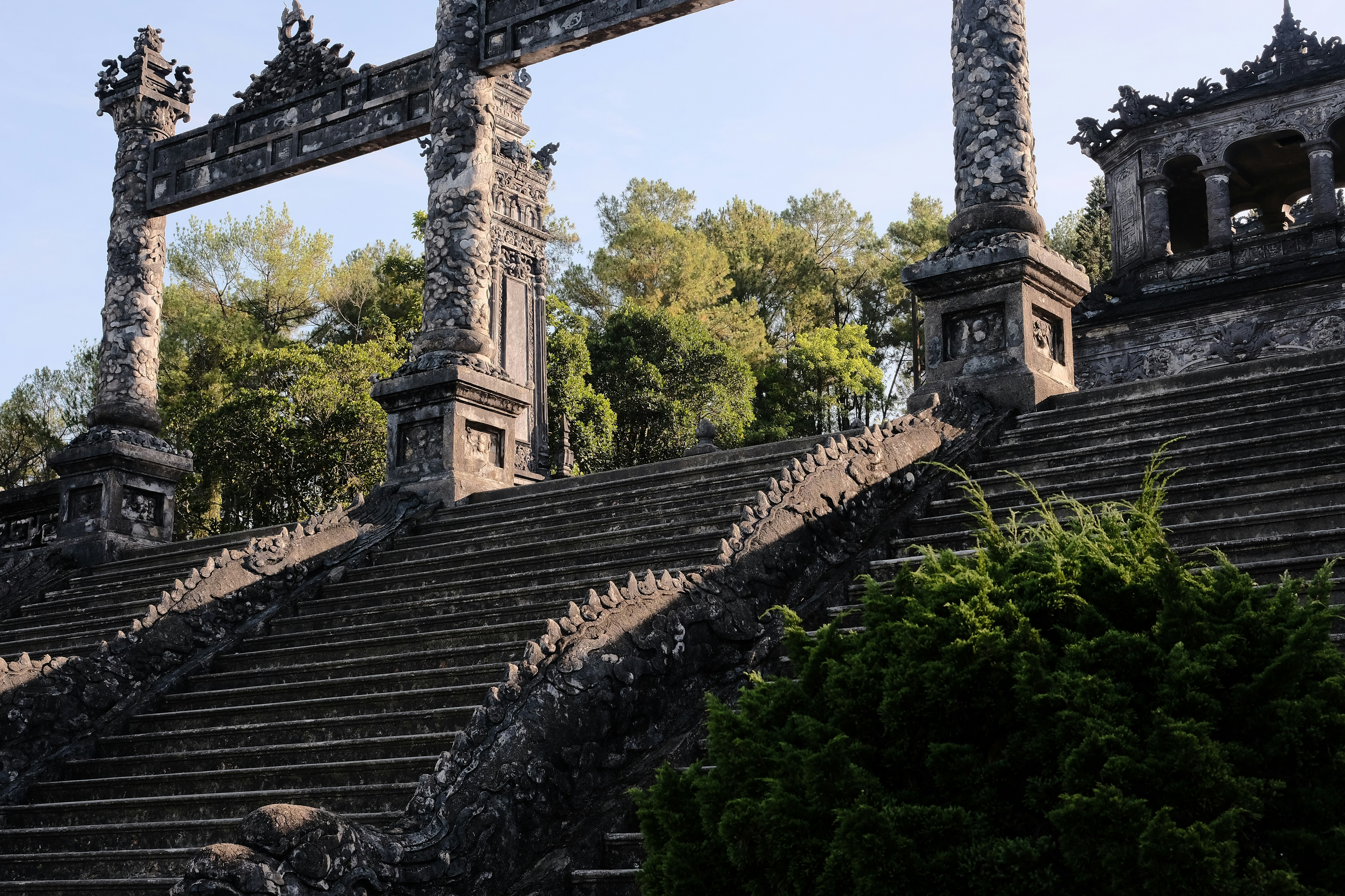 a group of stone steps leading up to a clock tower