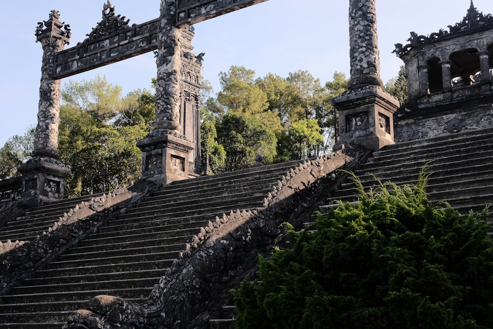 a group of stone steps leading up to a clock tower