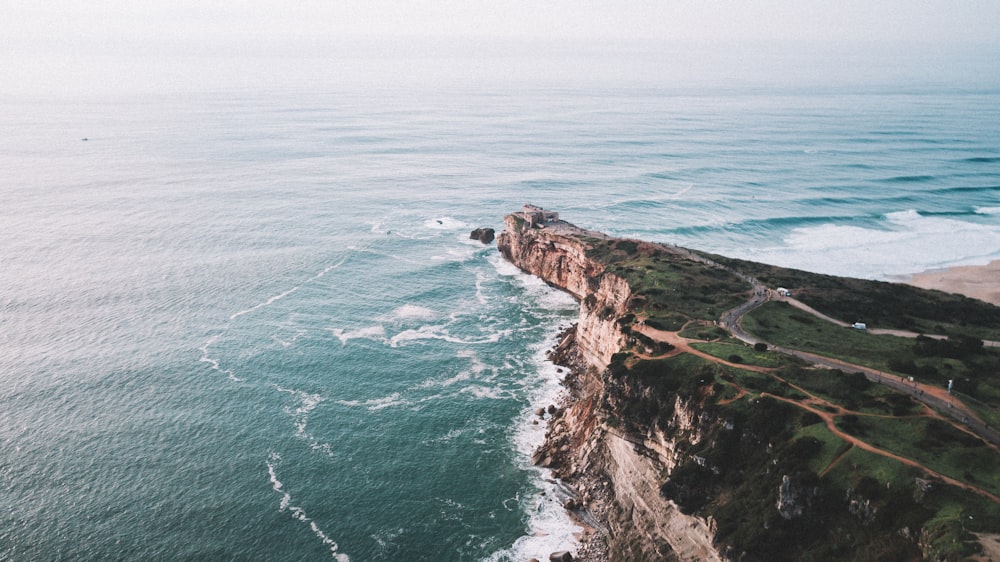 an aerial view of a cliff overlooking the ocean