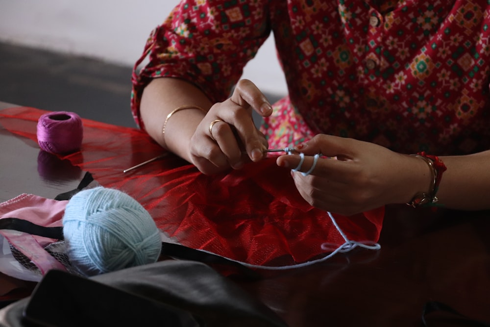 a woman working on a piece of cloth