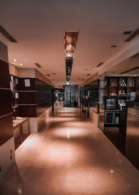 Entrance hall featuring polished marble flooring and subtle hidden lighting