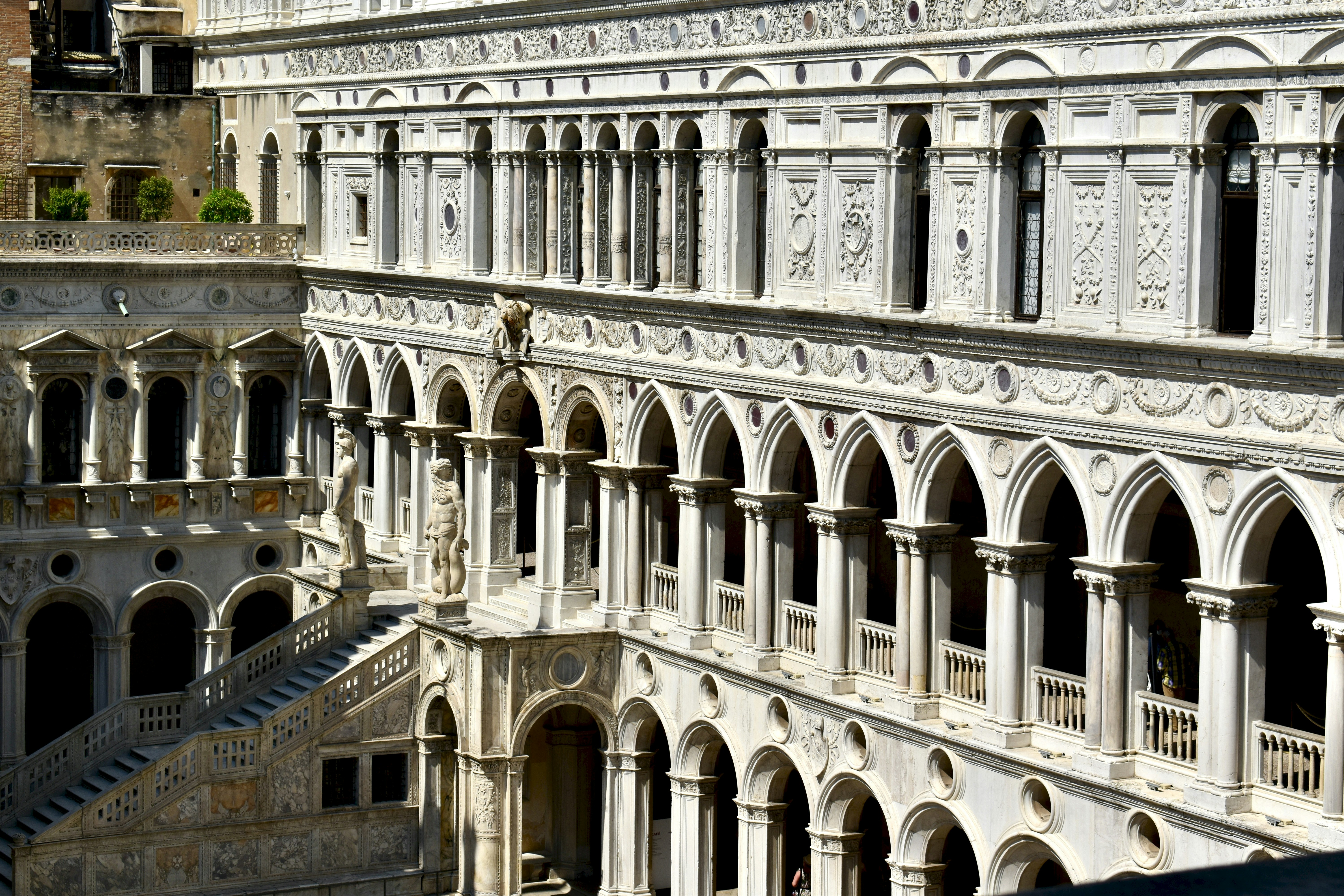 a very tall building with a clock on the side of it, Looking across the courtyard of the Doge’s palace in Venice