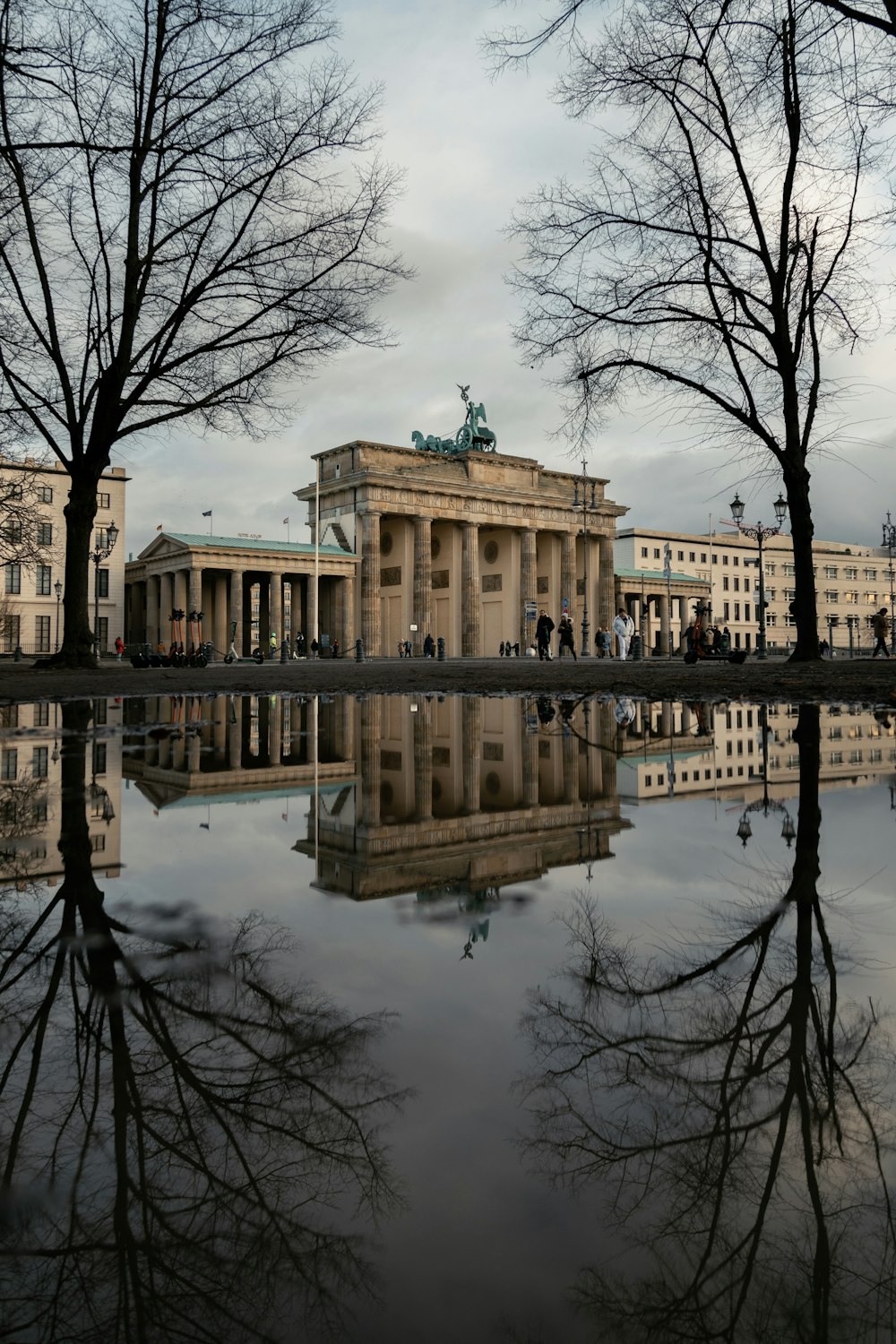 a reflection of a building in a body of water