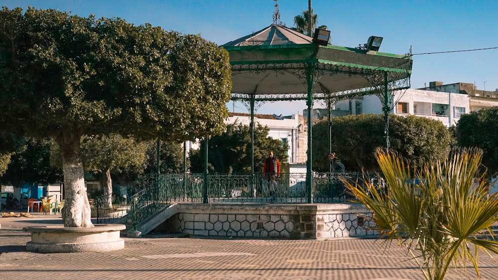 a gazebo sitting in the middle of a park