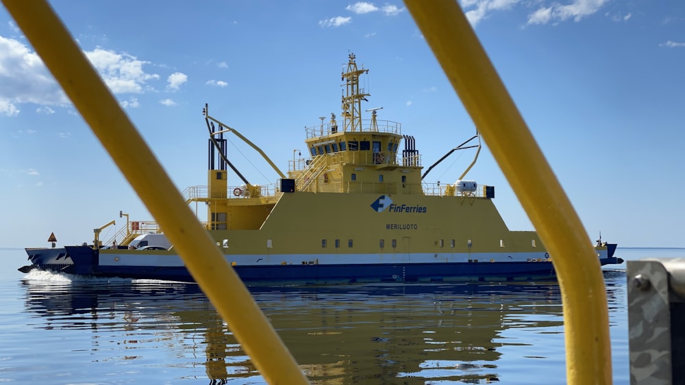 a yellow and blue boat in the water