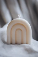 Elegant white candle with subtle floral details, perfect for a communion celebration.
