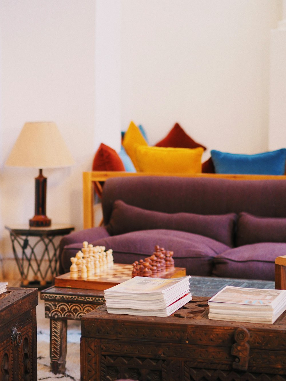 a living room filled with furniture and a chess board