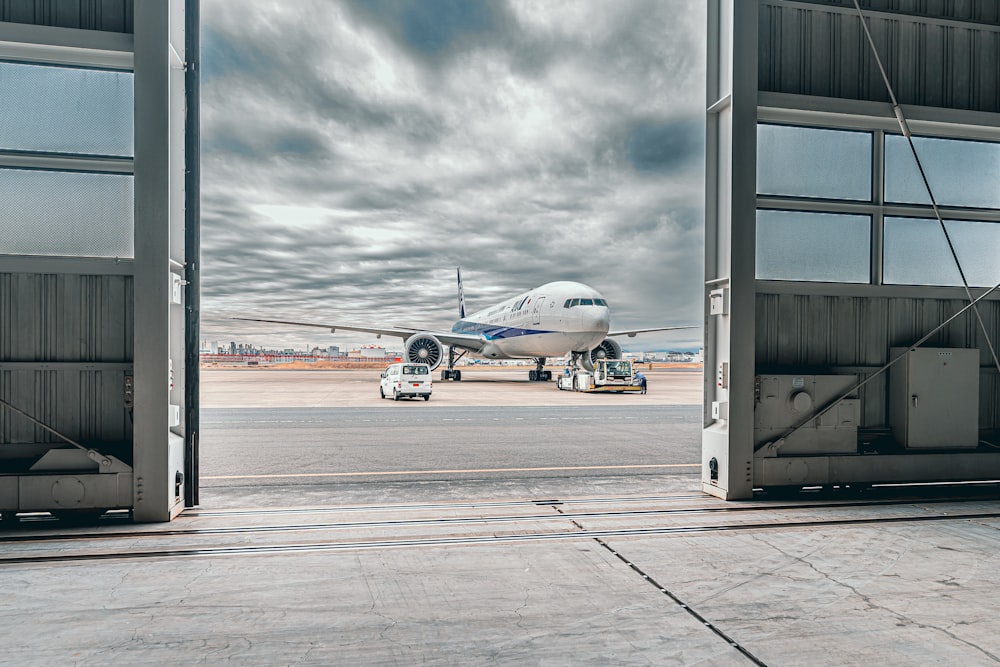 a large jetliner sitting on top of an airport tarmac