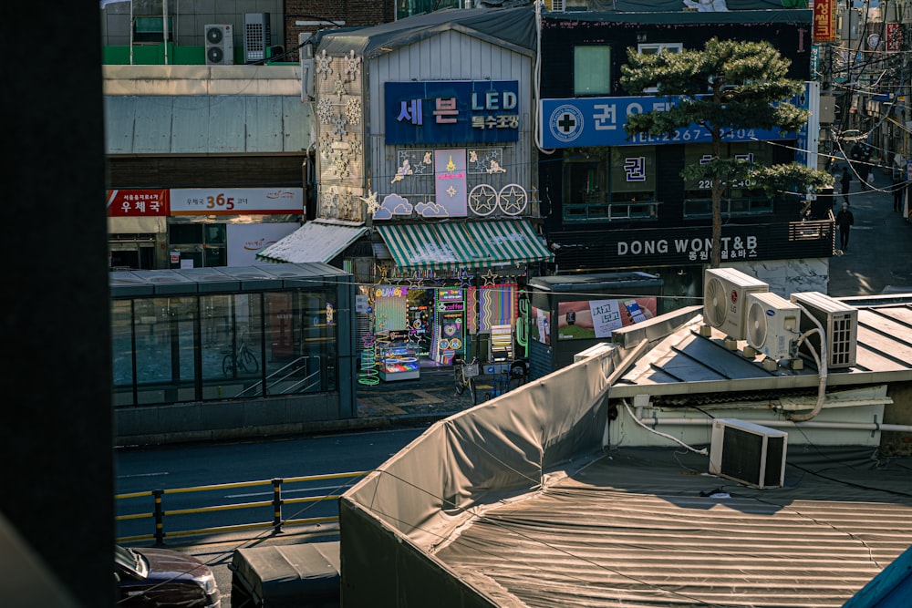 a view of a city street with buildings in the background