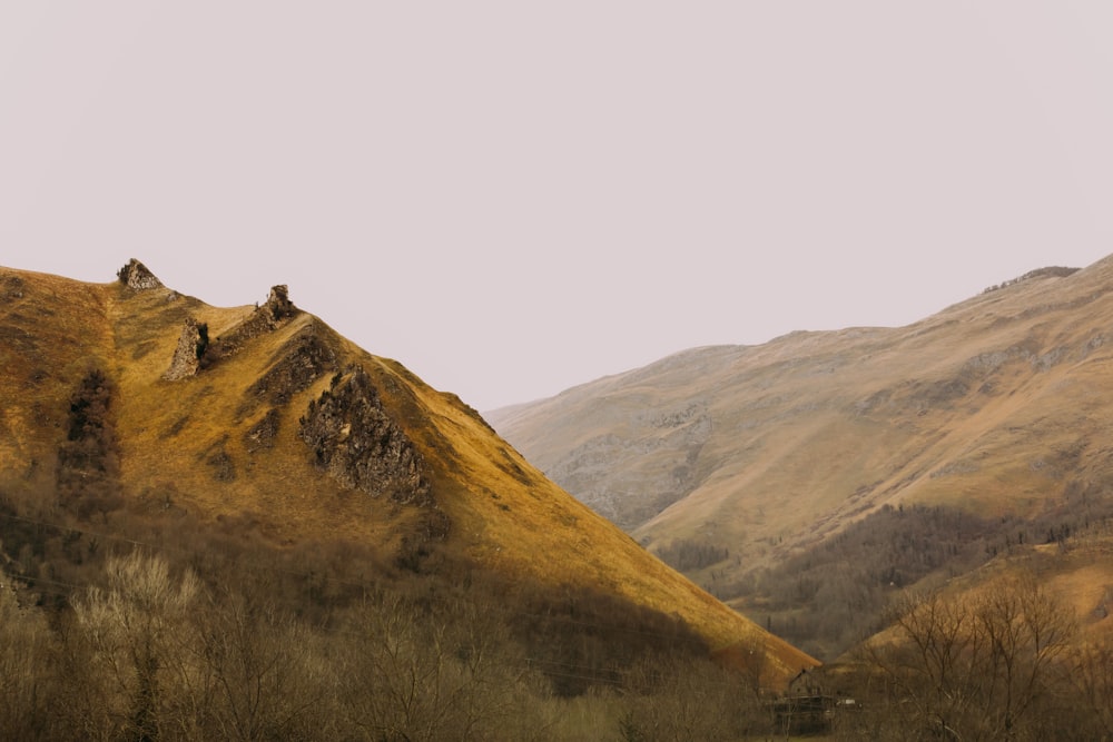 a scenic view of a mountain range in the distance