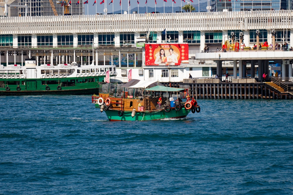 a green and brown boat in a body of water