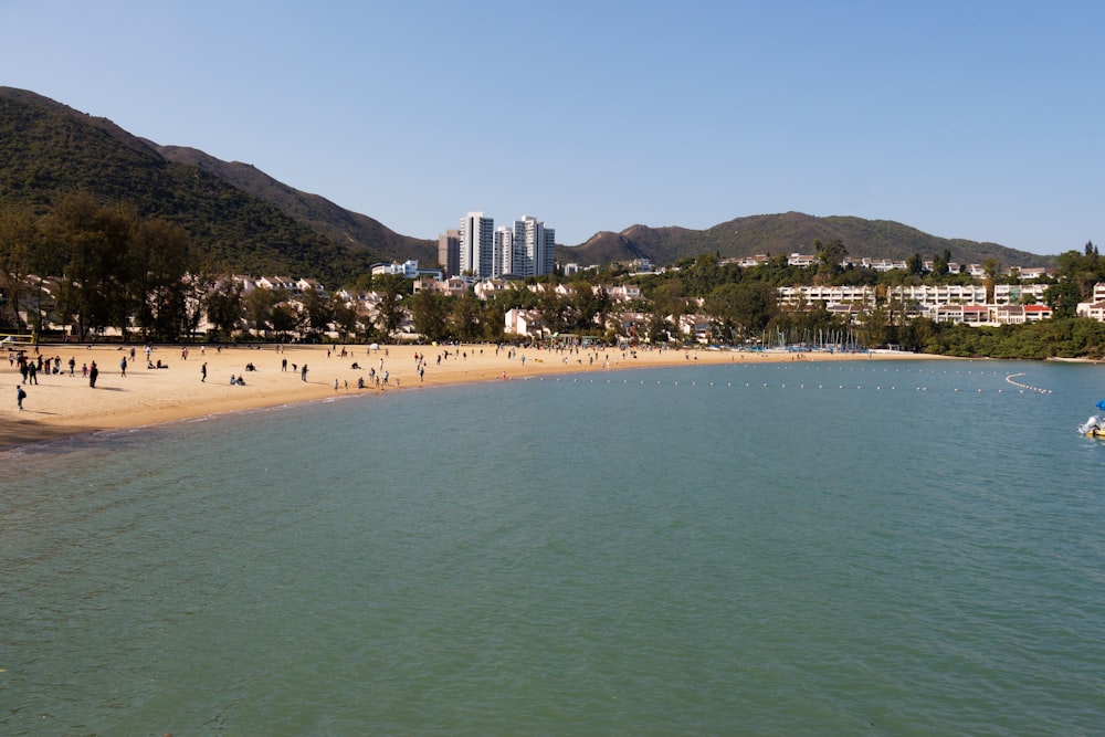 a large body of water next to a sandy beach