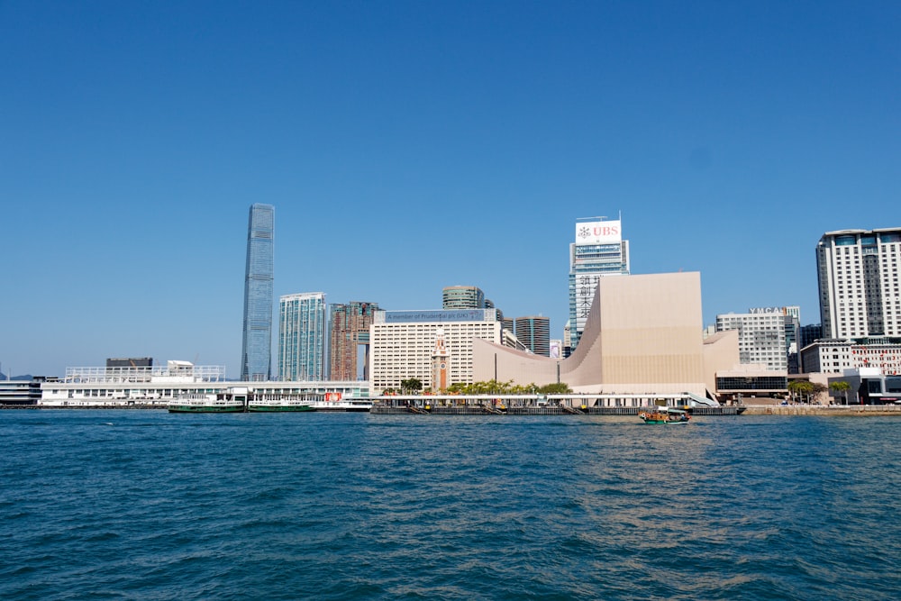 a large body of water with a city in the background