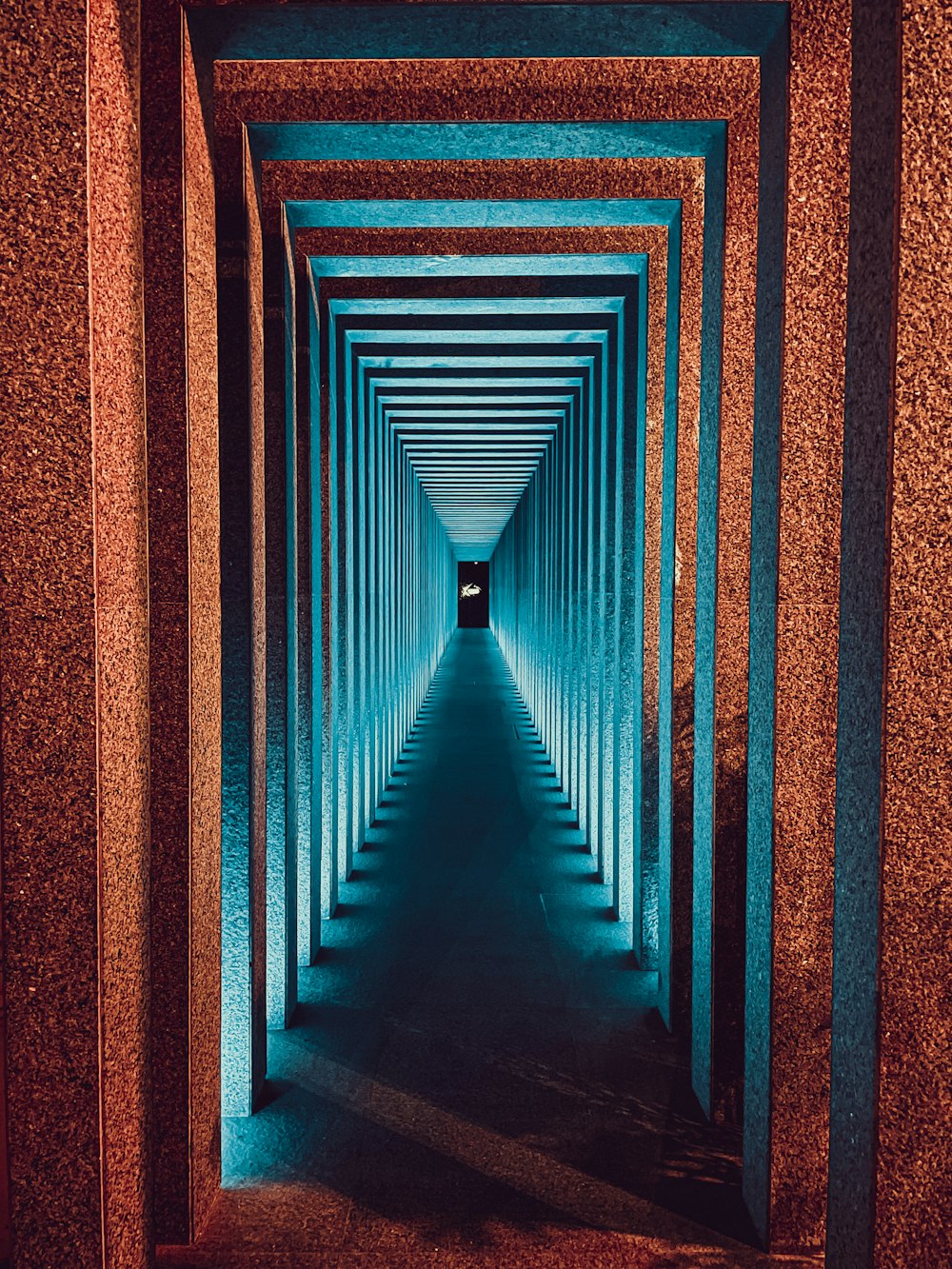 a long tunnel with a light at the end