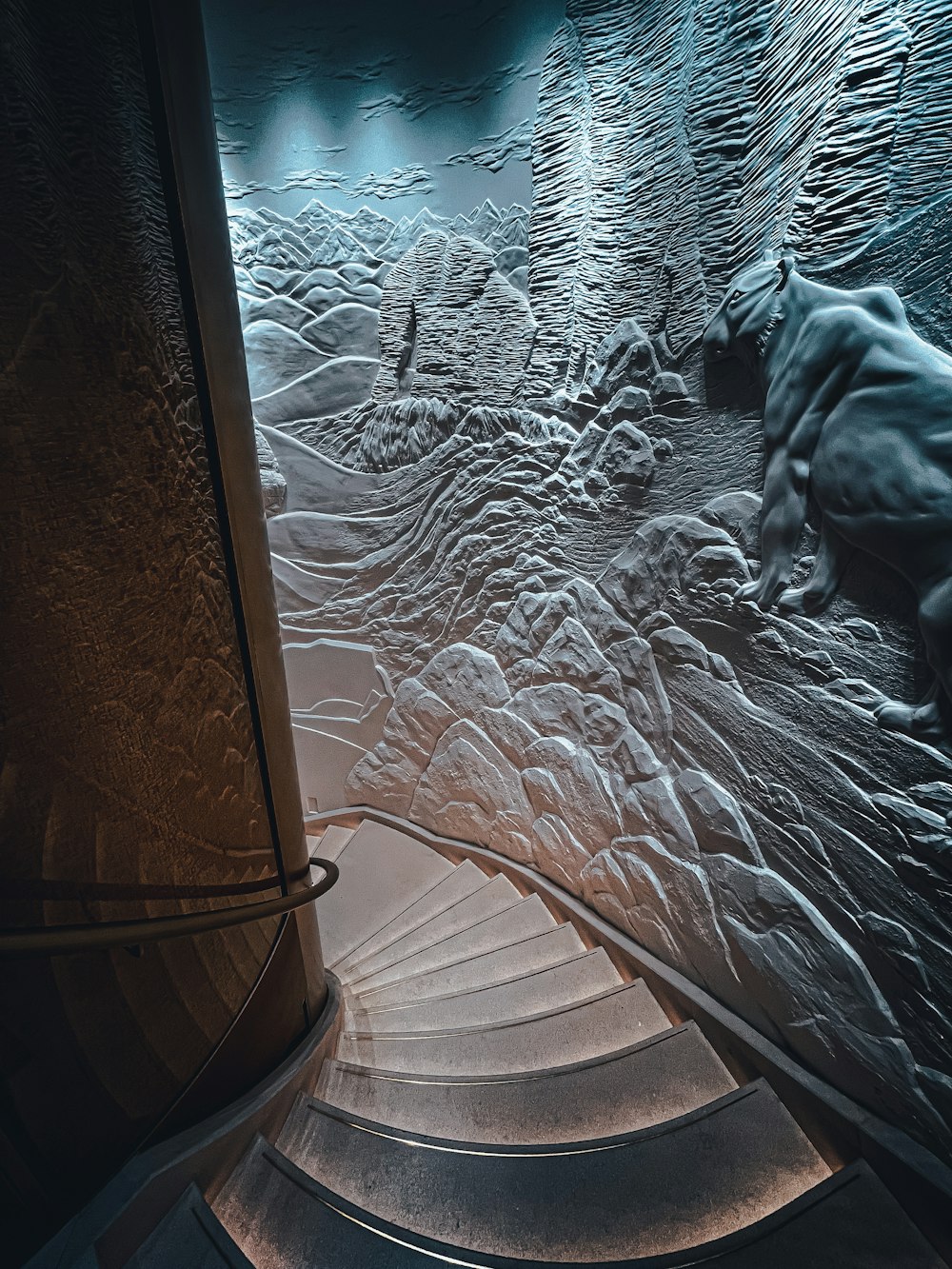 a spiral staircase in a building with frost on the glass