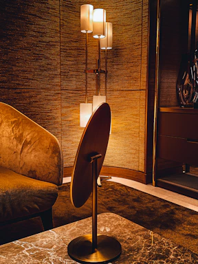 A warm, inviting modern interior living room showcasing a blend of textures and elegant lighting.