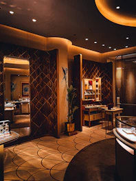 a dimly lit room with a large mirror