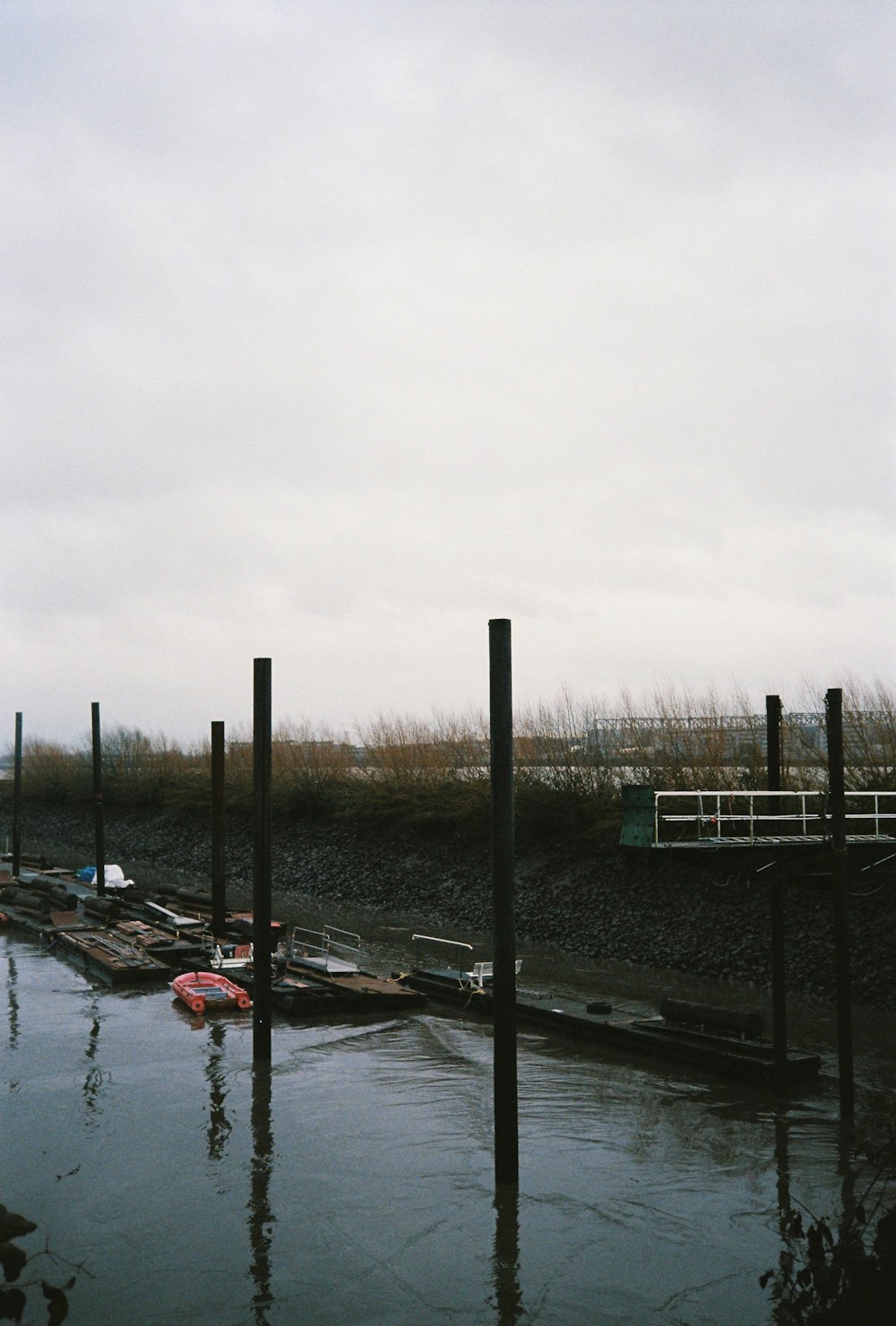 a body of water next to a wooden dock