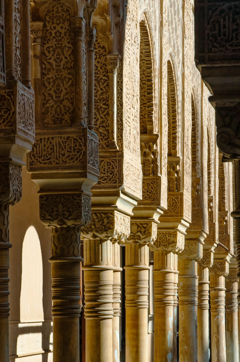 a row of stone pillars in a building