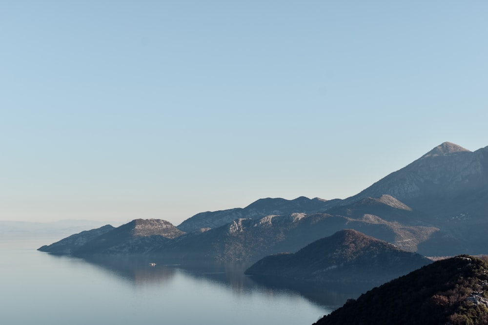 a large body of water surrounded by mountains