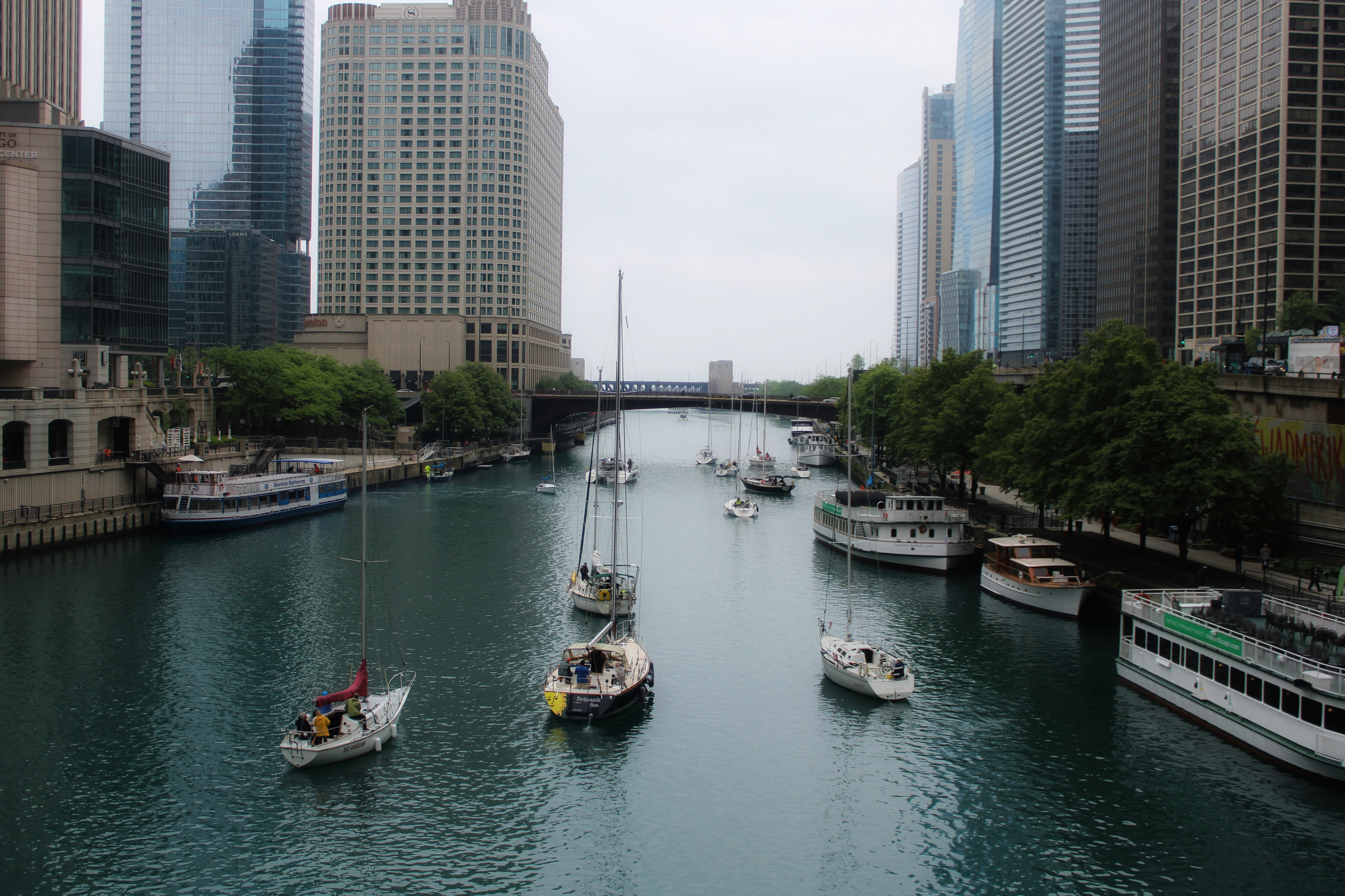 Chicago Riverwalk with tour boats and skyline - can you drink on boats in chicago