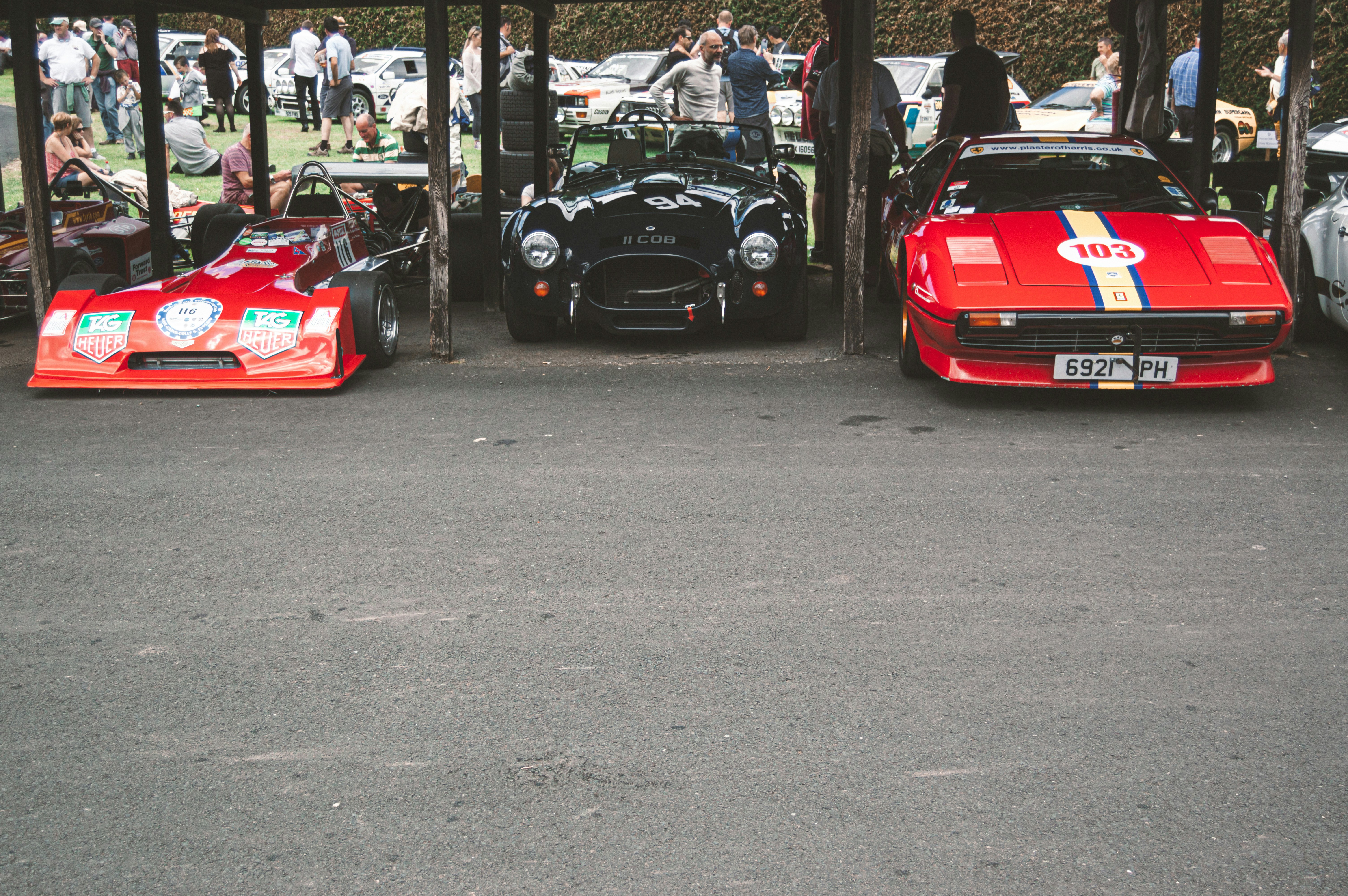 a group of cars parked next to each other in a parking lot