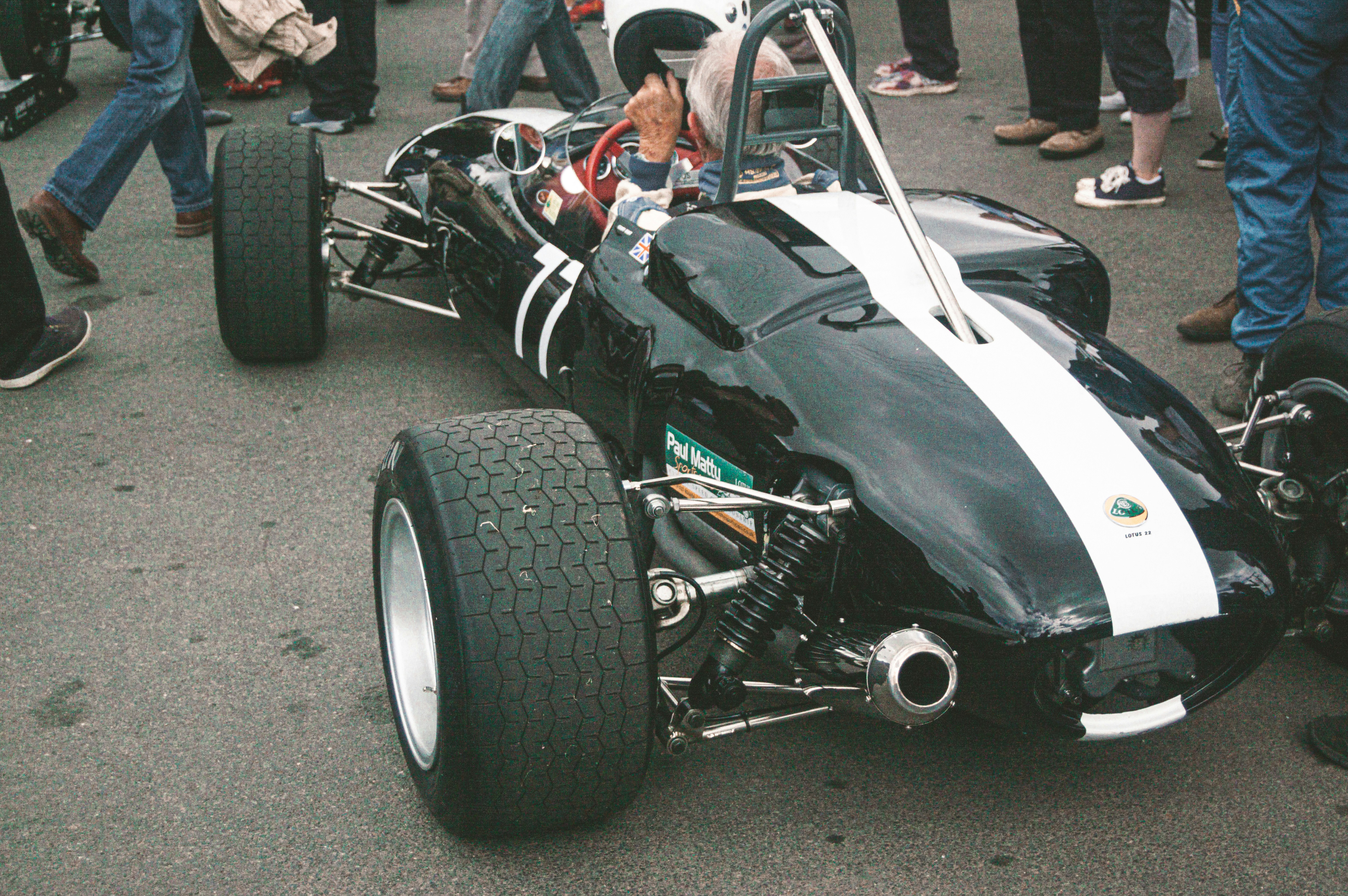 a black and white race car on a street