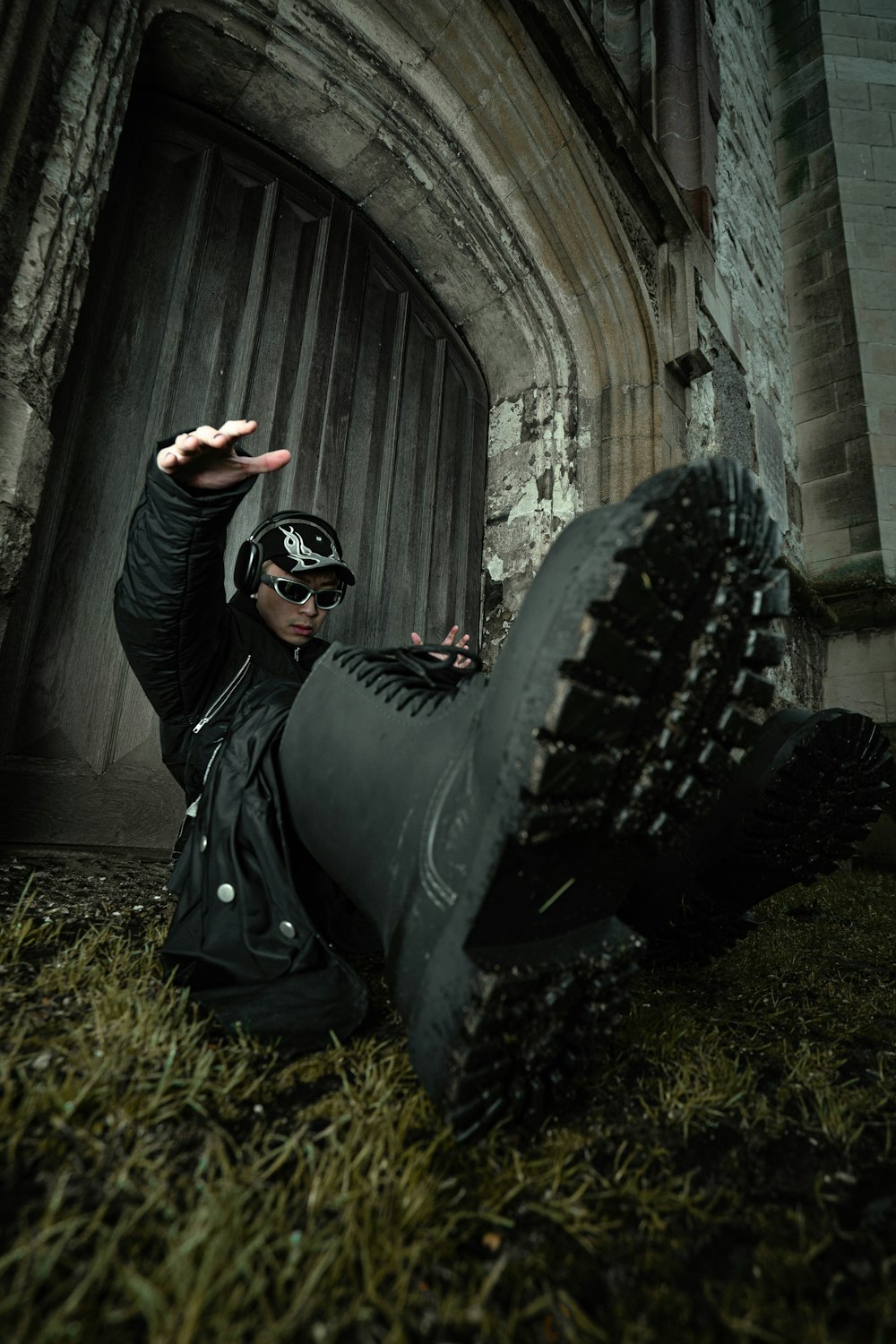 a man laying on the ground wearing a helmet