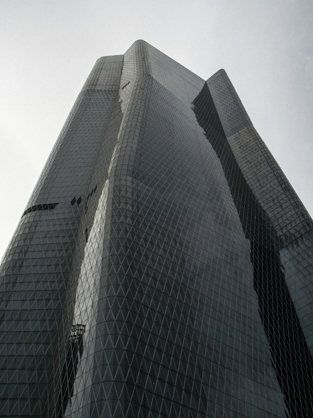 a very tall building with a sky background