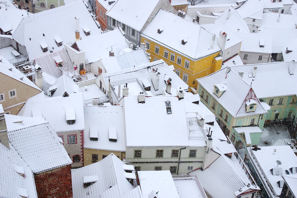 a view of a snowy city from the top of a building