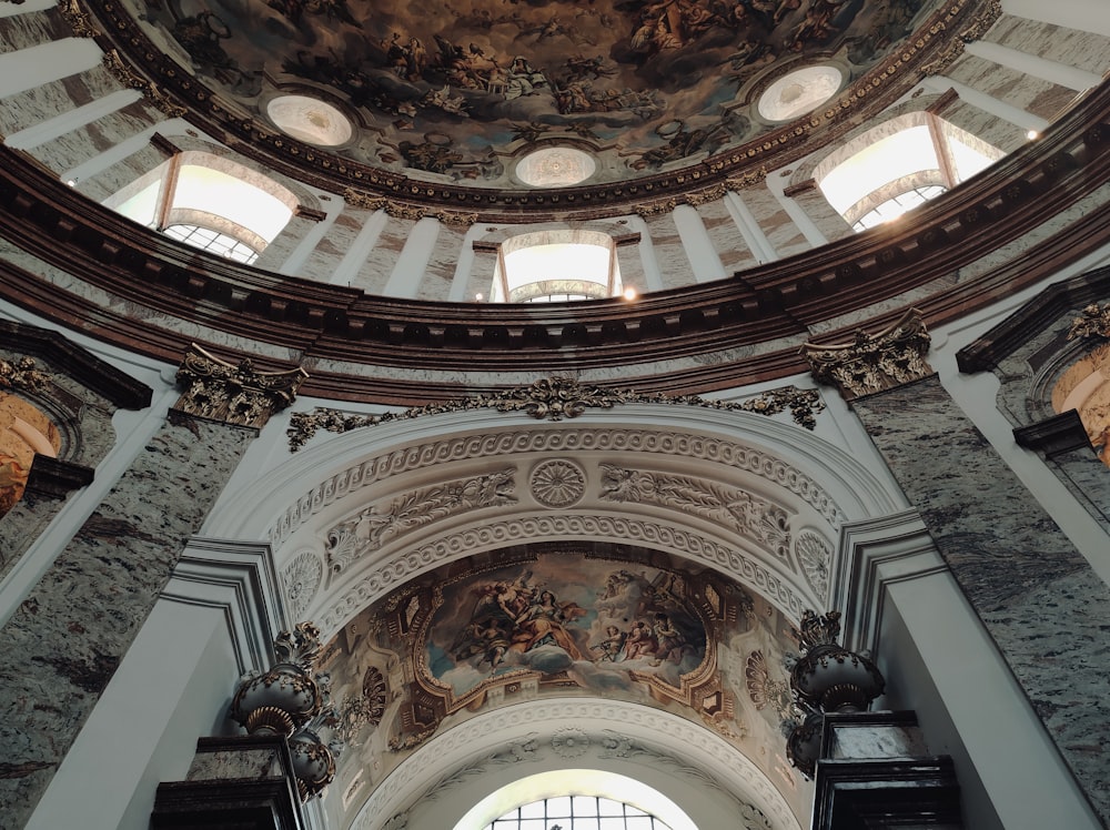 the ceiling of a church with a painting on it