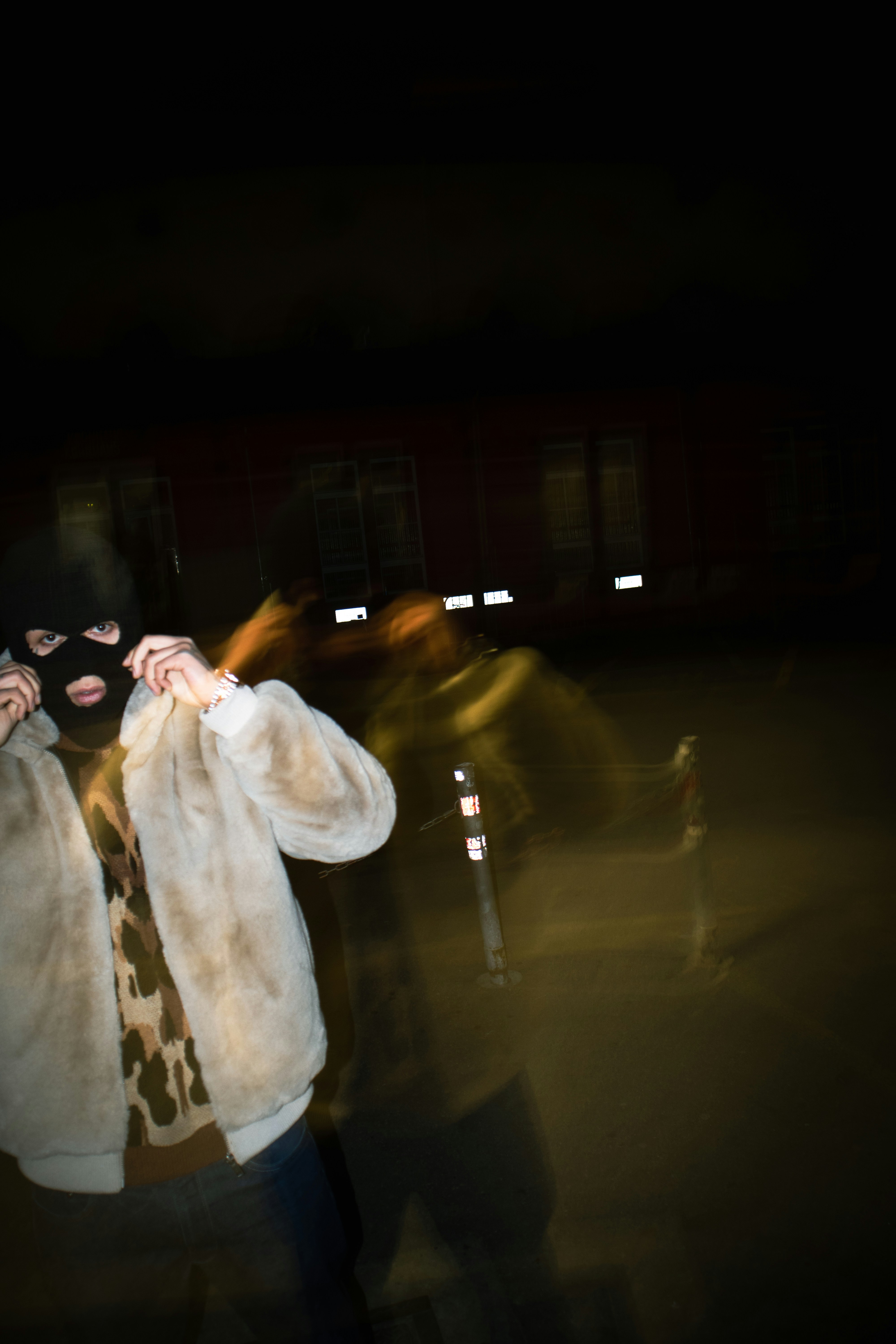 a blurry photo of a woman in a fur coat