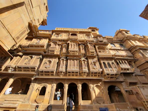 a tall building with many balconies on it