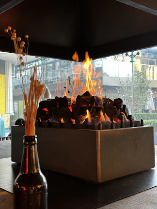 Detail of a bioethanol fireplace showcasing sleek metal craftsmanship and robust construction.