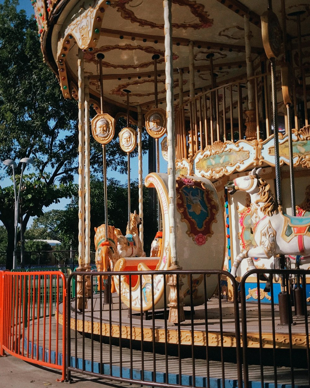 an old fashioned merry go round at a park