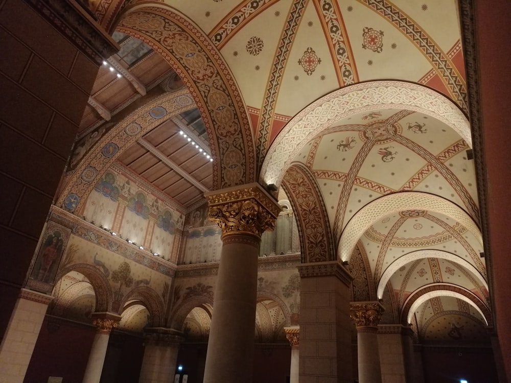 the ceiling of a large building with columns