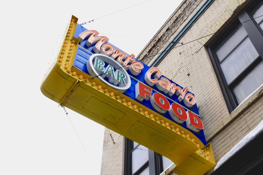 a neon sign for a bar called movie club bar food