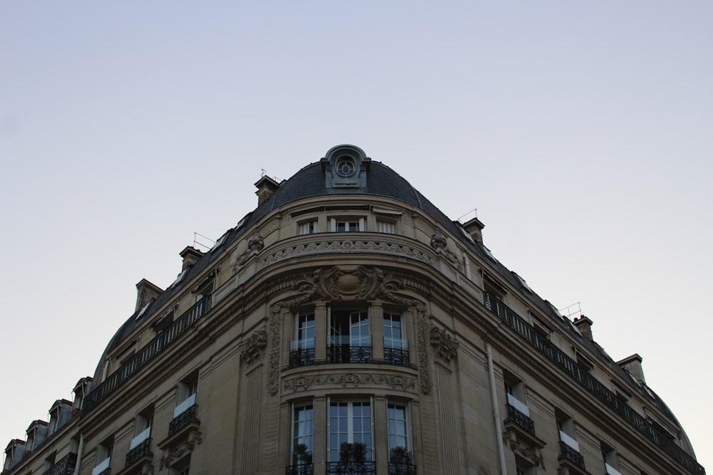 a tall building with a clock on the top of it