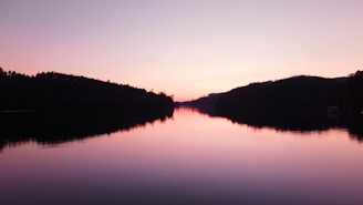A serene view of the Miramichi River at sunset, inviting relaxation and exploration.