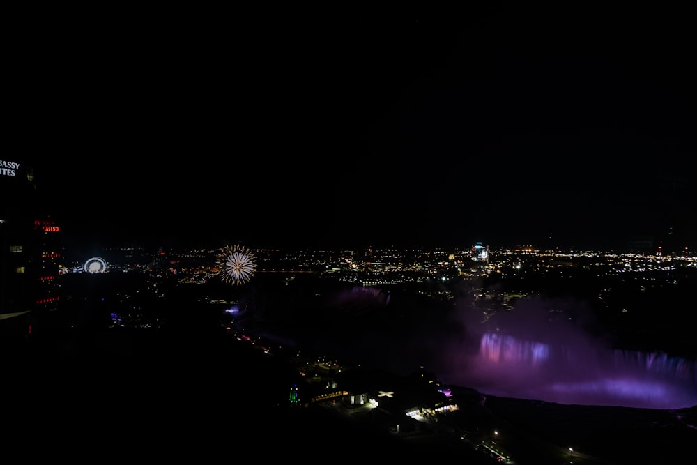 a view of a city at night with fireworks