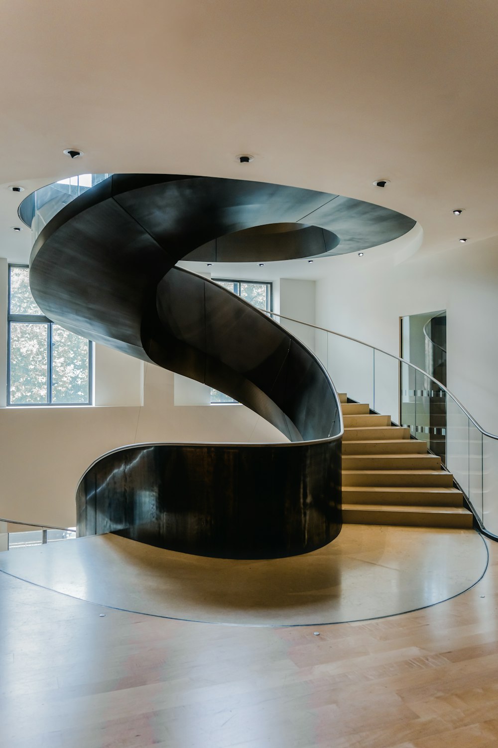 a large spiral staircase in a modern home