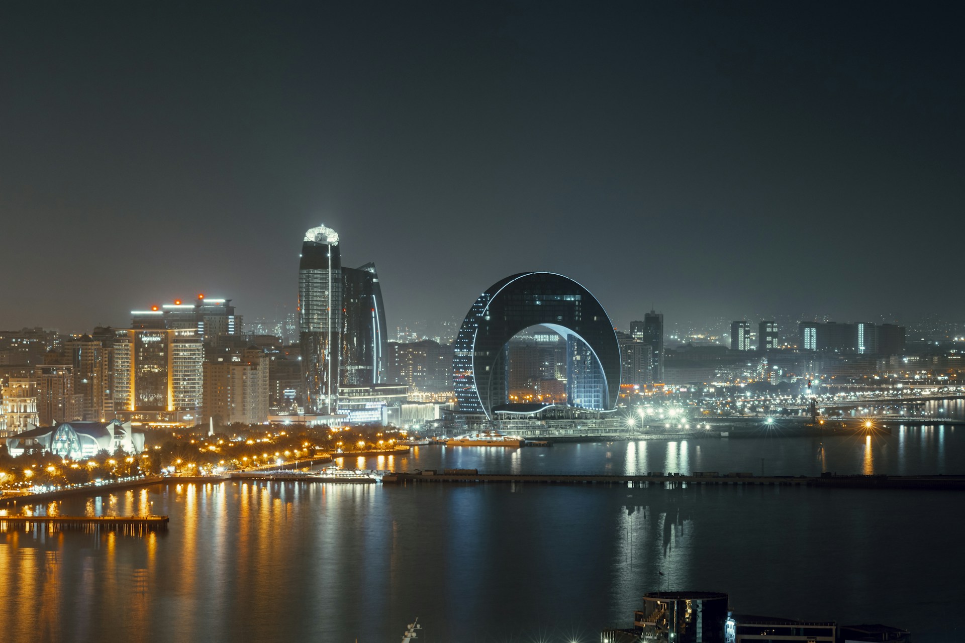 a large body of water with a city in the background
