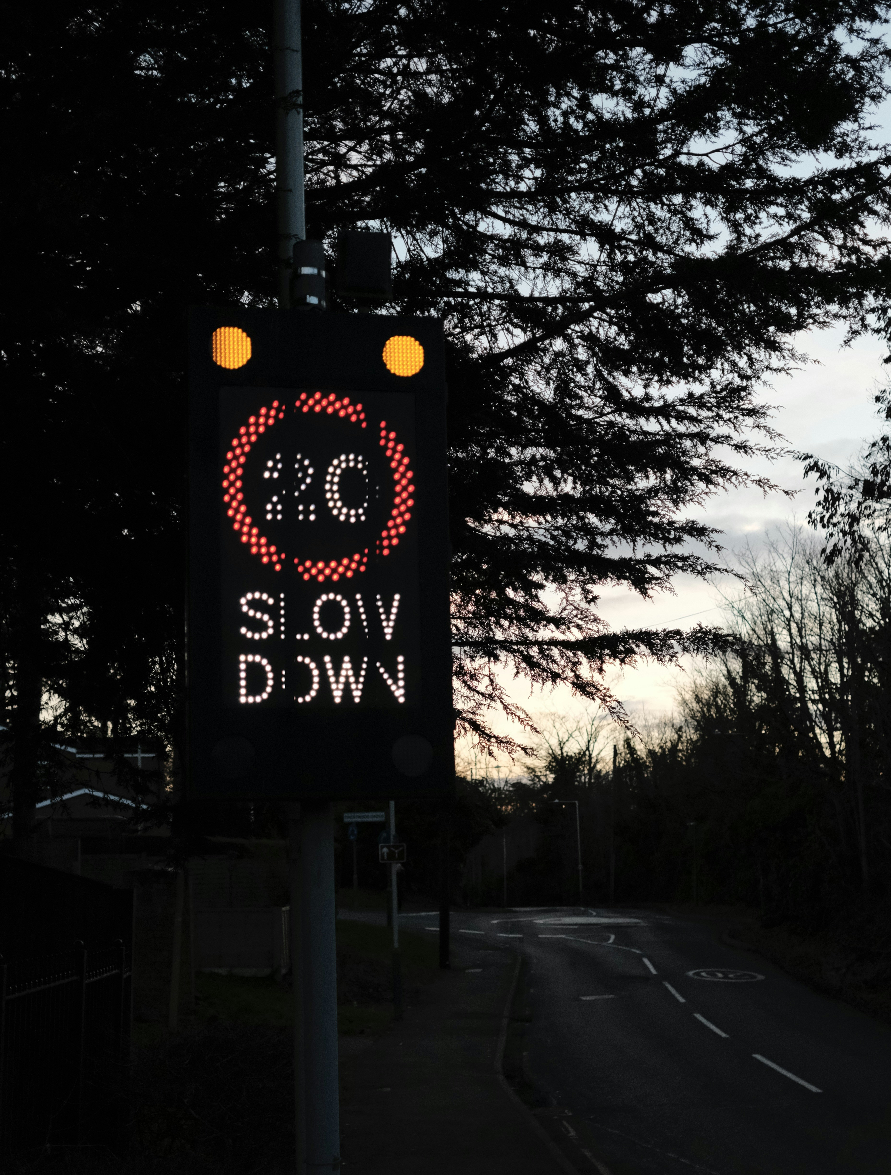 a street sign on a pole on the side of the road